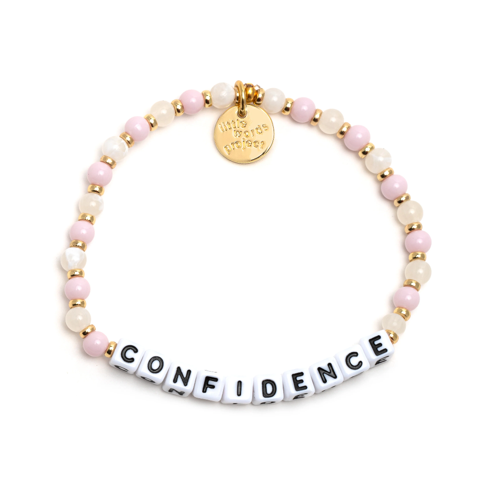 Pink bead bracelet that reads, Confidence.