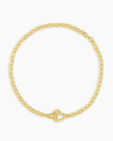 Gold chain bracelet with a mini heart closure from the brand of Gorjana. The gold is 18k gold plated.