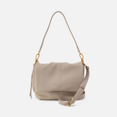 Harley Convertible Shoulder Bag in the color Taupe. The bag is designed from Pebbled leather from the brand HOBO.