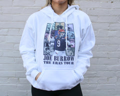 A white hoodie with Joe Burrow on the front, and the phrase "JOE BURROW THE ERAS TOUR""