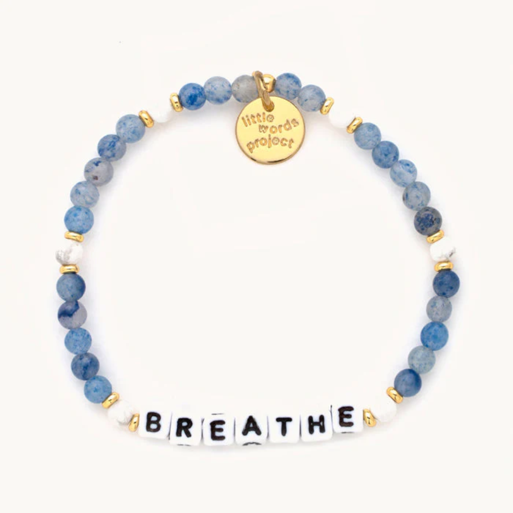 Blue bead bracelet from Little Words Project that reads, "BREATHE."