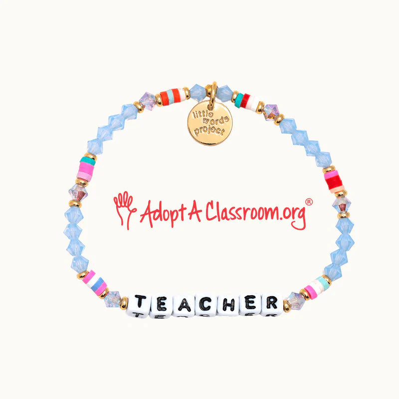 A beaded blue bracelet from Little Words Project® that has the phrase "Teacher" on it.