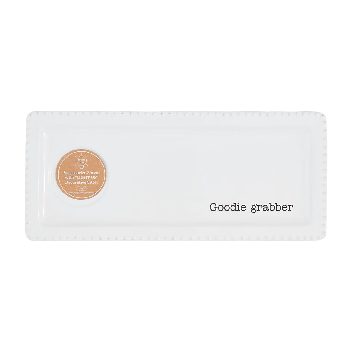 A long white platter that reads "Goodie Grabber."