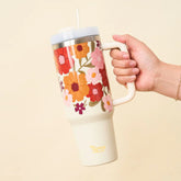 The Darling Effect 40 oz Take Me Everywhere Tumbler in cream. Featuring a floral pattern and The Darling Effect logo.