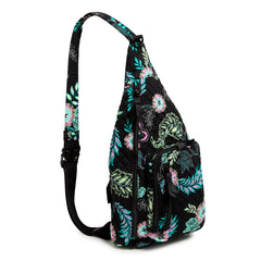 Sling Backpack In Island Garden Pattern, showing the side of the book bag, with the shoulder strap pulled back.