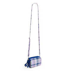 A RFID All in One Crossbody Wallet In Amethyst Plaid Patter, with the crossbody strap extended.