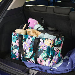 Vera Bradley ReActive Large Car Tote In Island Floral Pattern, shown in the back seat of a car.