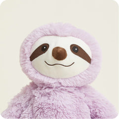Close up of the face of a smiling purple sloth