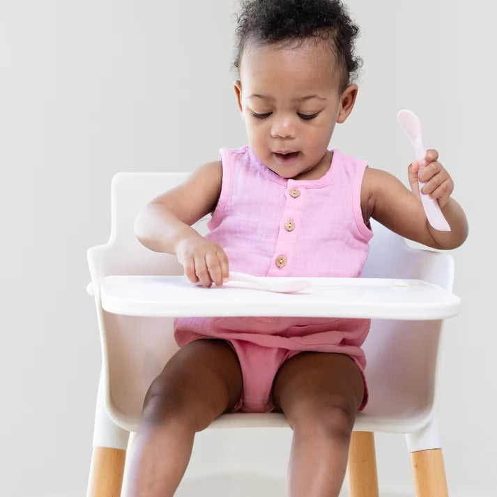 A set of 2 baby spoons in the color pink. One spoon reads, "All Hail The Queen." The other spoon reads, "Little Miss Fabulous ." This spoon set comes from the brand Bella Tunno.