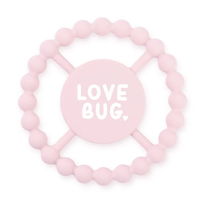 Pink color Happy Teether that reads, "LOVE BUG" in the middle. The teether is made from silicone, and comes from the brand Bella Tunno.