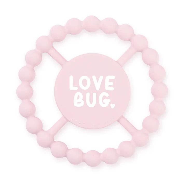 Pink color Happy Teether that reads, "LOVE BUG" in the middle. The teether is made from silicone, and comes from the brand Bella Tunno.