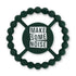 Green color Happy Teether that reads, "MAKE SOME NOISE" in the middle. The teether is made from silicone, and comes from the brand Bella Tunno.