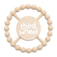 TAN color Happy Teether that reads, "THIRD WHEEL" in the middle. The teether is made from silicone, and comes from the brand Bella Tunno.