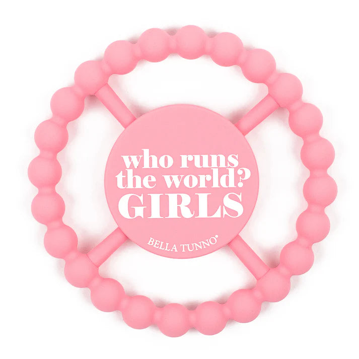 Pink color Happy Teether that reads, "who runs the world? GIRLS." in the middle. The teether is made from silicone, and comes from the brand Bella Tunno.