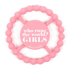 Pink color Happy Teether that reads, "who runs the world? GIRLS." in the middle. The teether is made from silicone, and comes from the brand Bella Tunno.