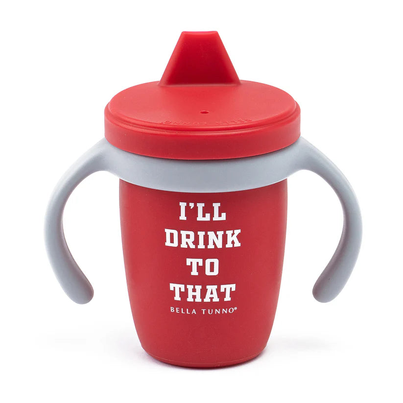 A red color sippy cup, with gray handles. The sippy cup reads, "I'll Drink To That" with the Bella Tunno logo at the bottom.