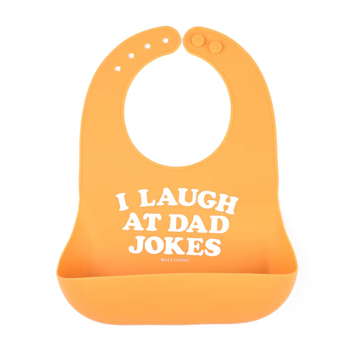 Orange color Wonder Bib that reads, "I Laugh A Dad Jokes" with the Bella Tunno logo below it. The bib is adjustable in size with 4 snaps that easily fit around the neck. The Wonder Bib is designed out of silicone, and is made by Bella Tunno.