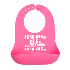 Pink color Wonder Bib that reads, "It's Me, Hi. I'm The Baby It's Me." with the Bella Tunno logo below it. The bib is adjustable in size with 4 snaps that easily fit around the neck. The Wonder Bib is designed out of silicone, and is made by Bella Tunno.