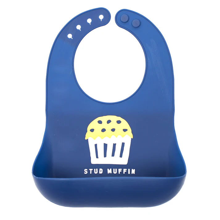 Blue color Wonder Bib that reads, "STUD MUFFIN" with an illustration of a muffin above it. The bib is adjustable in size with 4 snaps that easily fit around the neck. The Wonder Bib is designed out of silicone, and is made by Bella Tunno.