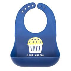 Blue color Wonder Bib that reads, "STUD MUFFIN" with an illustration of a muffin above it. The bib is adjustable in size with 4 snaps that easily fit around the neck. The Wonder Bib is designed out of silicone, and is made by Bella Tunno.