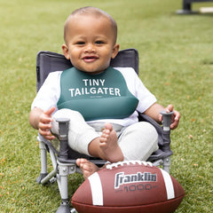 Green color Wonder Bib that reads, "Tiny Tailgater" with the Bella Tunno logo below it. The bib is adjustable in size with 4 snaps that easily fit around the neck. The Wonder Bib is designed out of silicone, and is made by Bella Tunno.