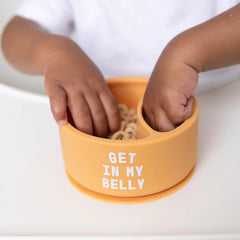 A Bella Tunno Wonder Bowl for kids in the color orange that reads, "Get In My Belly." 