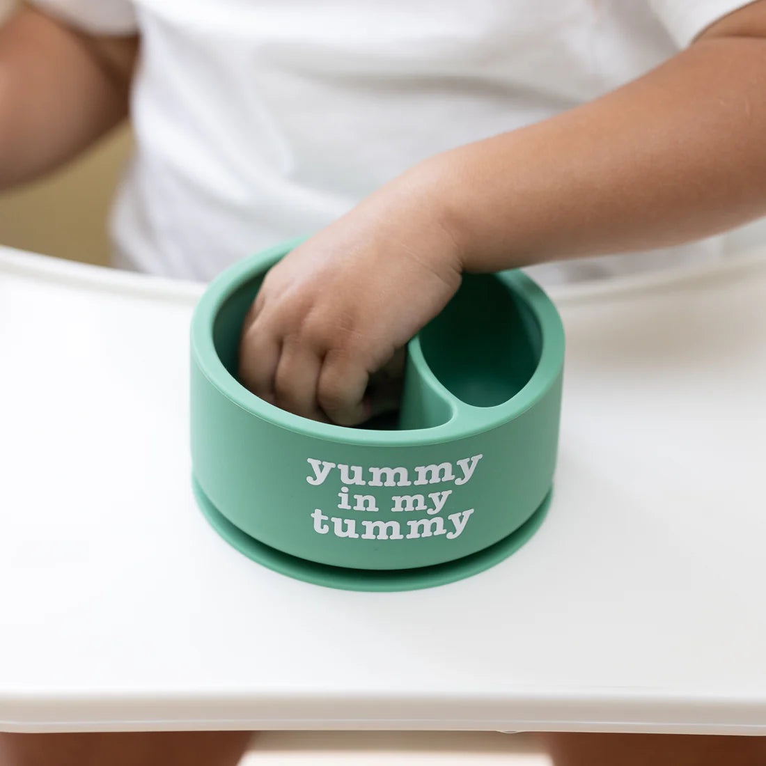 A Bella Tunno Wonder Bowl for kids in the color green that reads, "Yummy in My Tummy." 