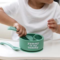 A Bella Tunno Wonder Bowl for kids in the color green that reads, "Yummy in My Tummy." 