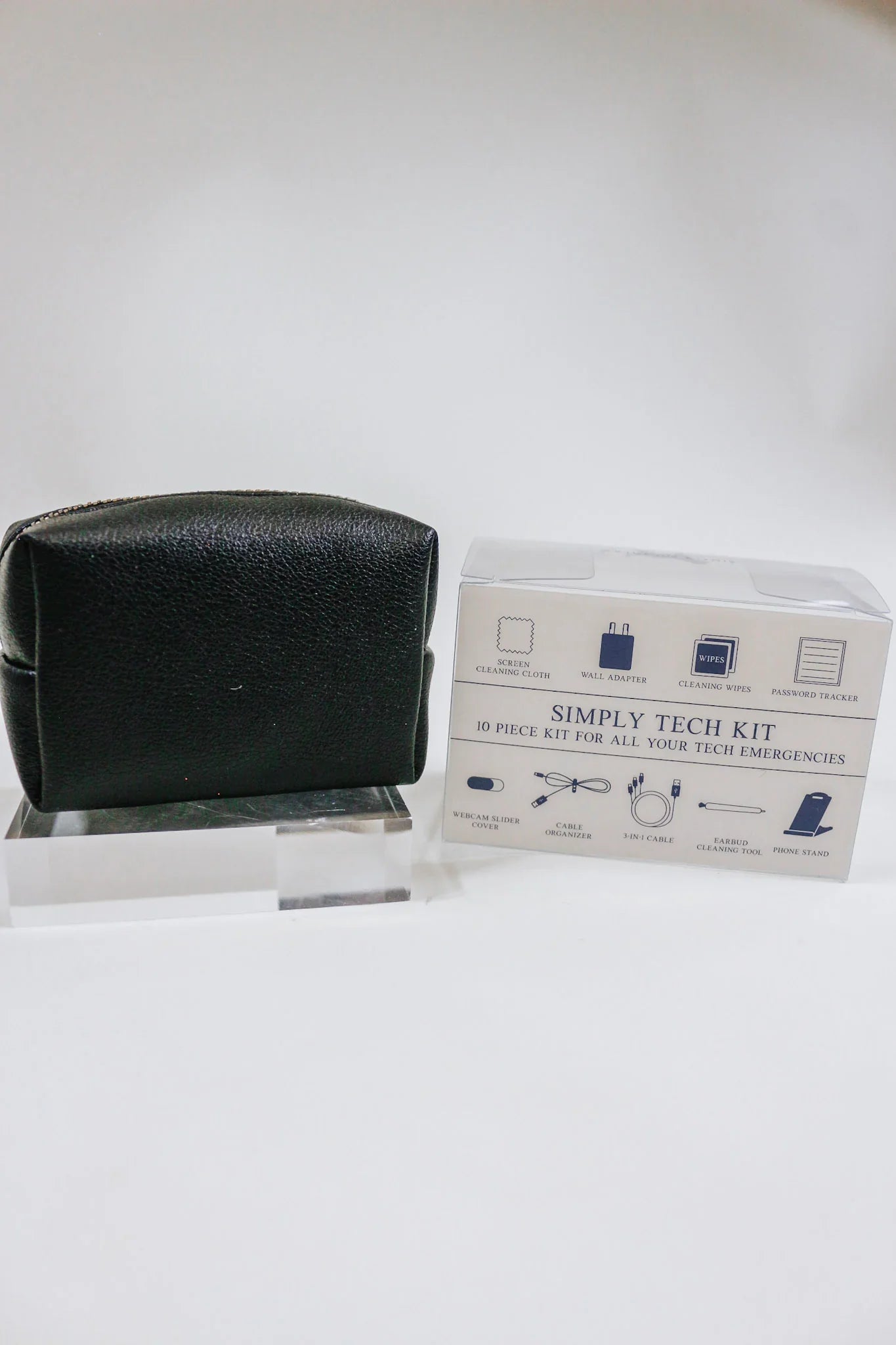 Black simply tech kit, a. 10 pice kit for all your tech emergencies. Carry screen cleaning clothes, wall adapters, cleaning wipes, password trackers, webcam slider covers, cables, earbud cleaners, and phone stands.