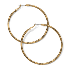 Grande Hoop Charm Earrings from Brighton Designs. The earrings are the color gold, and feature a black symbol all around them.