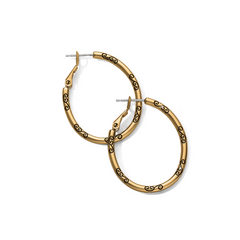 Gold earrings from Brighton Designs. The earrings feature a black symbol all around them.