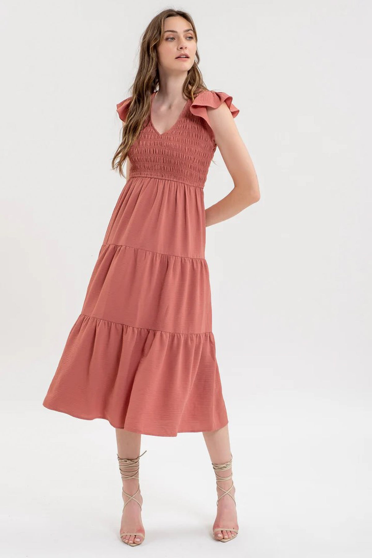 A flutter sleeve midi dress in a rose color.