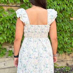 The back shoulder view of the Floral Midi Dress, with sleeveless shoulders.