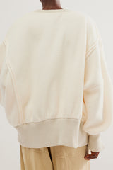 White vanilla pullover sweater from Free People.