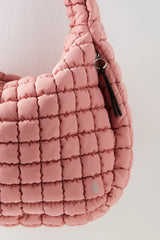 Free People Movement Quilted Carryall Bag in color pink.