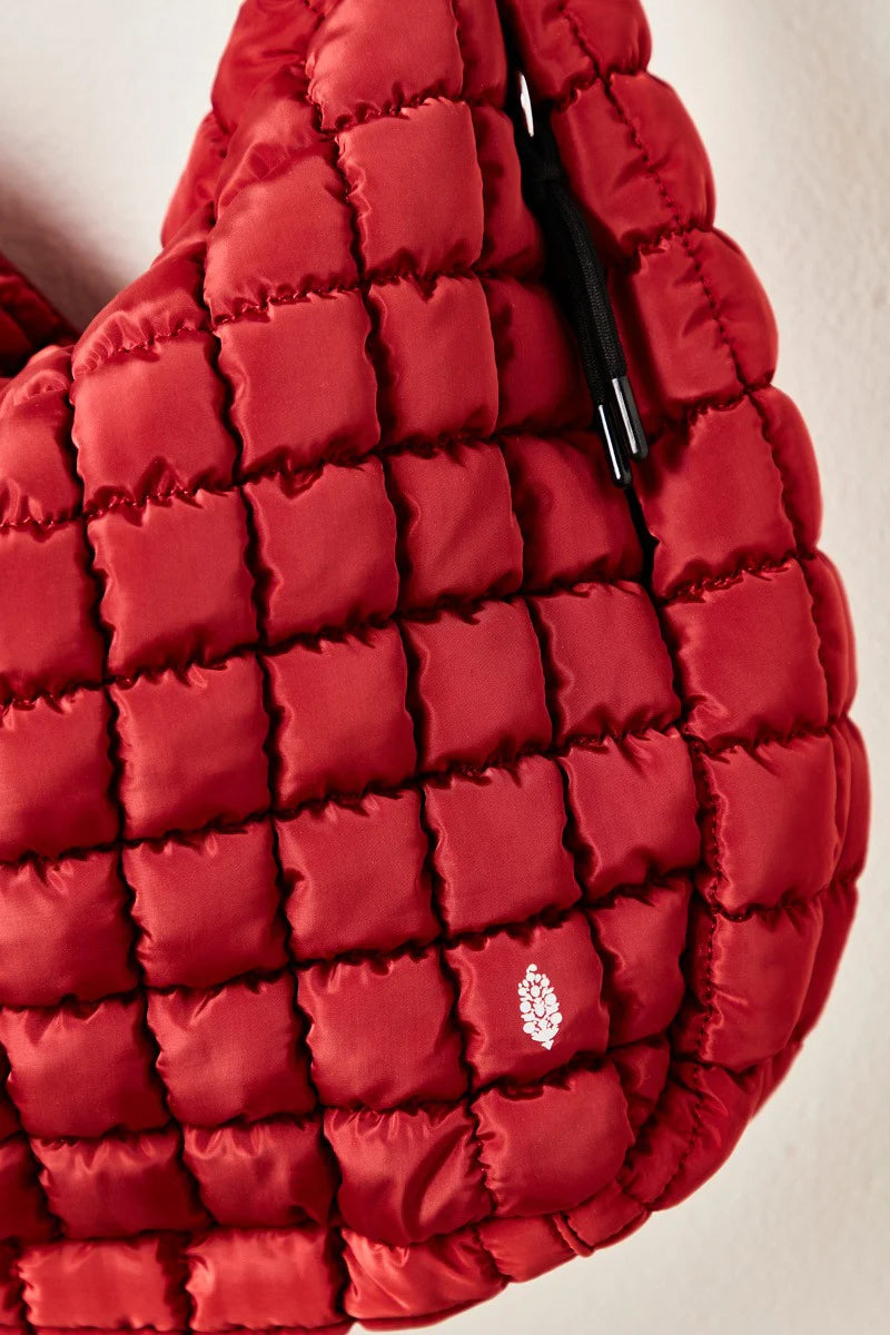 Free People Movement Quilted Carryall Bag in color red.