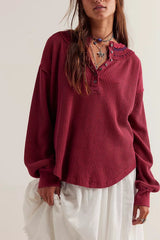 Women's henley shirt in the color red from the brand Free People.