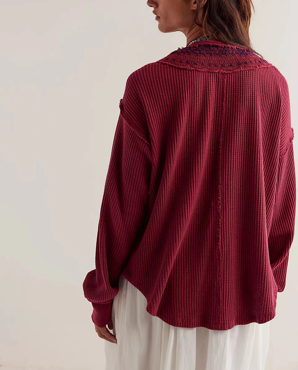 Women's henley shirt in the color red from the brand Free People.