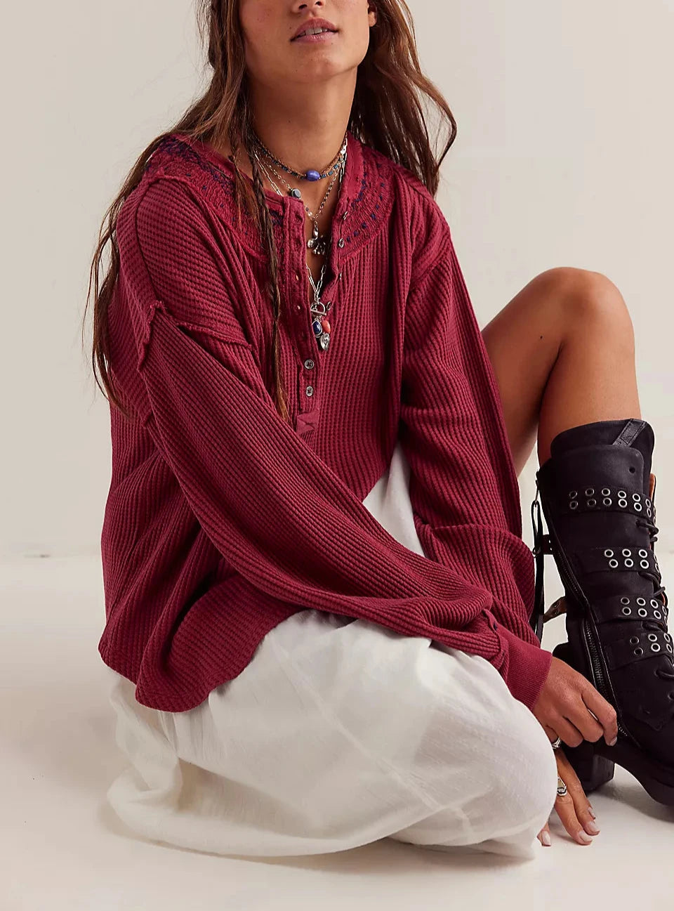 Women's henley shirt in the color red from the brand Free People.