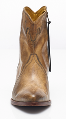 Women's western style boot from the brand Free People. The boot is the color tan.