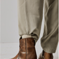 Women's western style boot from the brand Free People. The boot is the color tan.