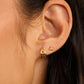 18k gold plated Initial A huggie earring from the jewelry brand Gorjana.