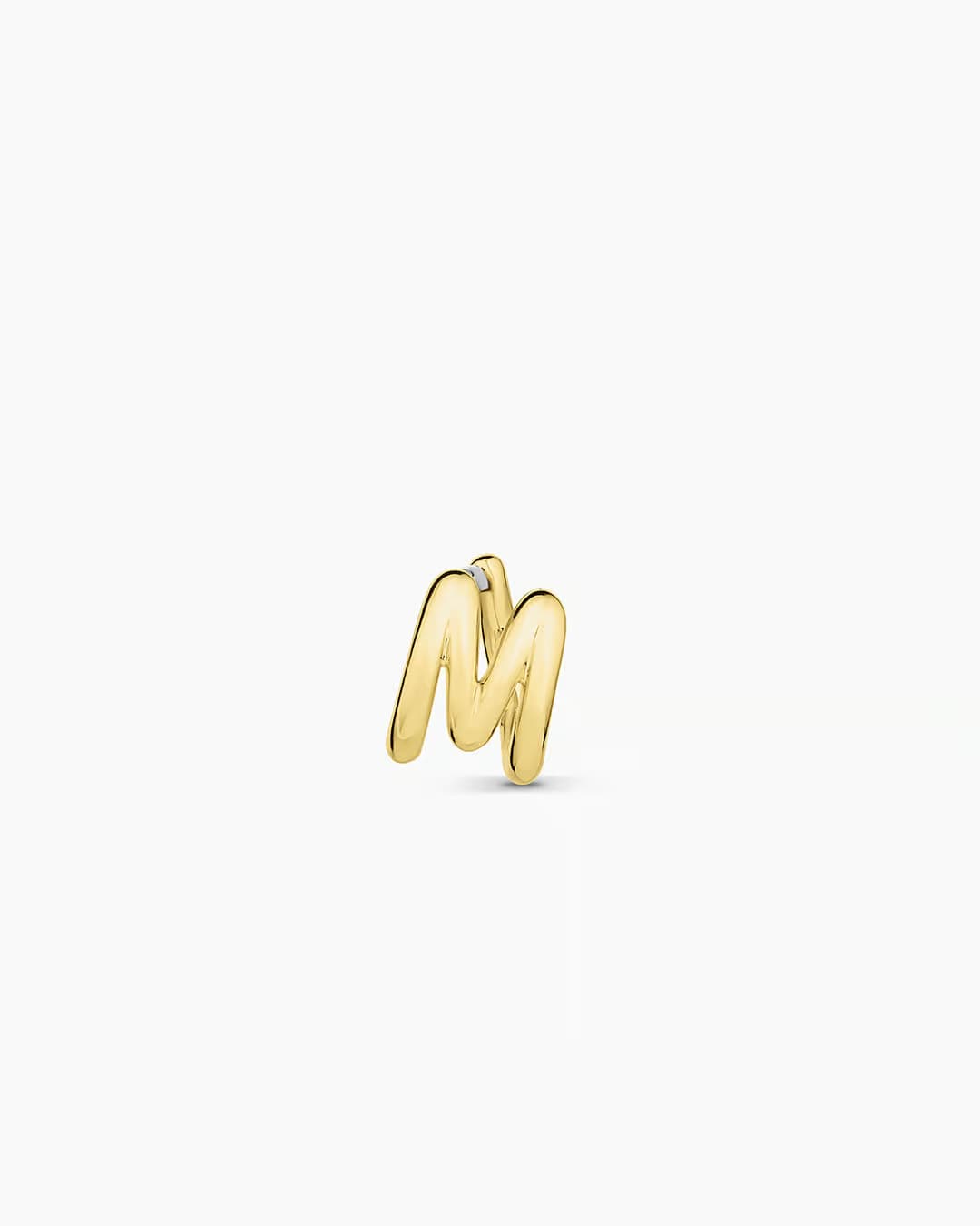 18k gold plated Initial M huggie earring from the jewelry brand Gorjana.