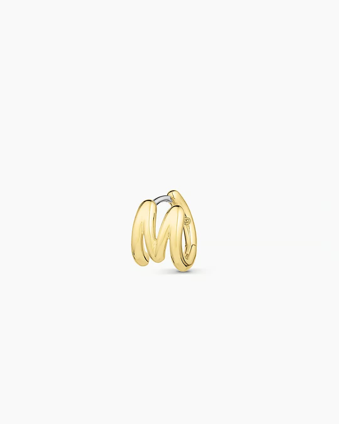 18k gold plated Initial M huggie earring from the jewelry brand Gorjana.