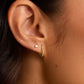 Single 18k gold huggie earring from the jewelry brand Gorjana.