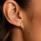 18k gold plated single huggie earring from the brand Gorjana.
