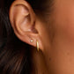 18k Gold plated single huggie earring from the jewelry brand Gorjana.