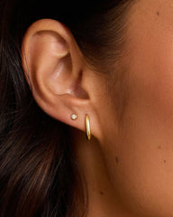 18k Gold plated single huggie earring from the jewelry brand Gorjana.