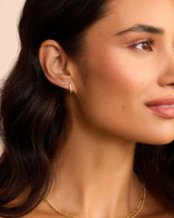 18k gold plated single huggie earring from the jewelry brand Gorjana.