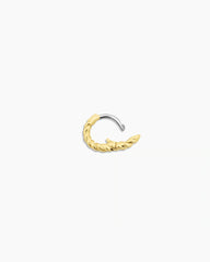 Single 18k gold huggie earring from the jewelry brand Gorjana.